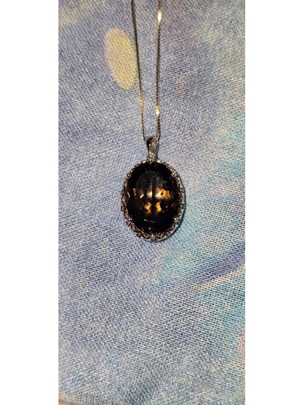 Genuine 8ct Smokey Quartz set in s925 with a s925 fine silver chain